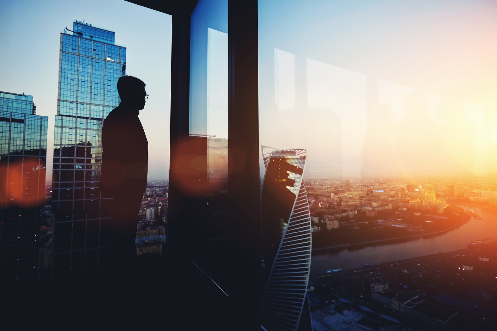 Edward Samson surveying the skyline from a rooftop